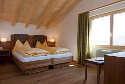 Planning and realisation of the hotel rooms in the Hotel Waldhaus in Leukerbad.